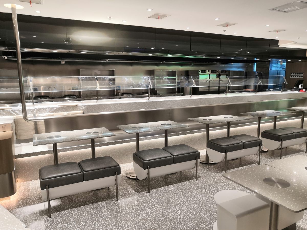 custom terrazzo counter and floor in a restaurant interior terrazzo restaurant flooring and counter project by Aoli Stone