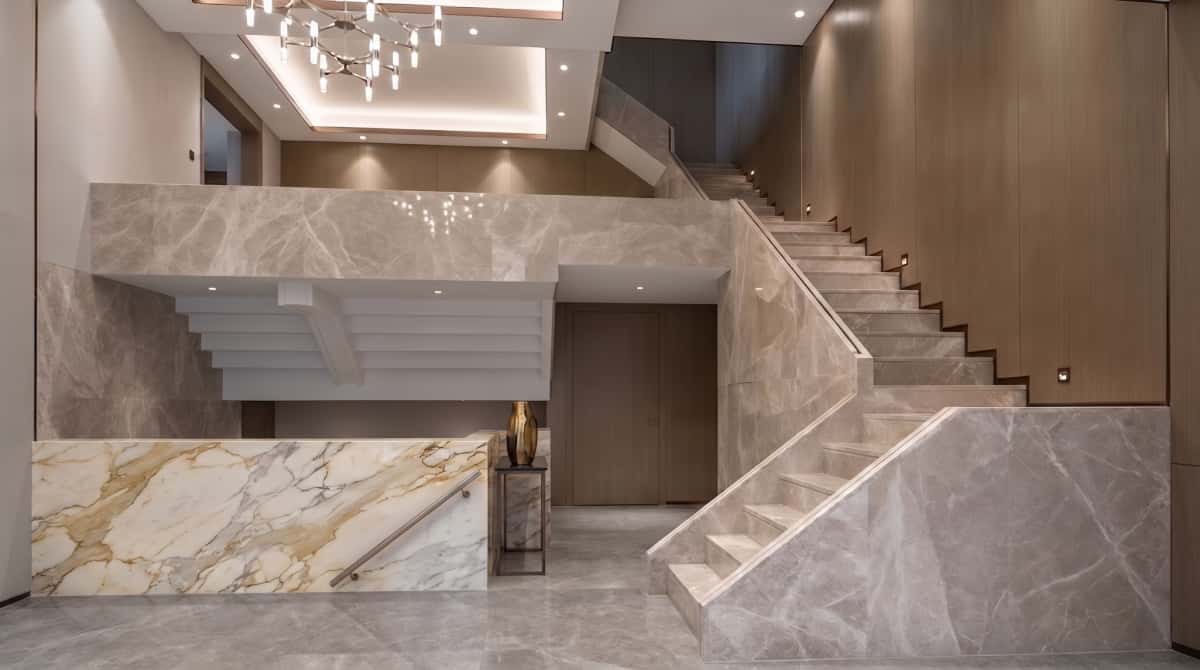 Turkish beige-grey marble staircase project with matching wall cladding and stair side panels