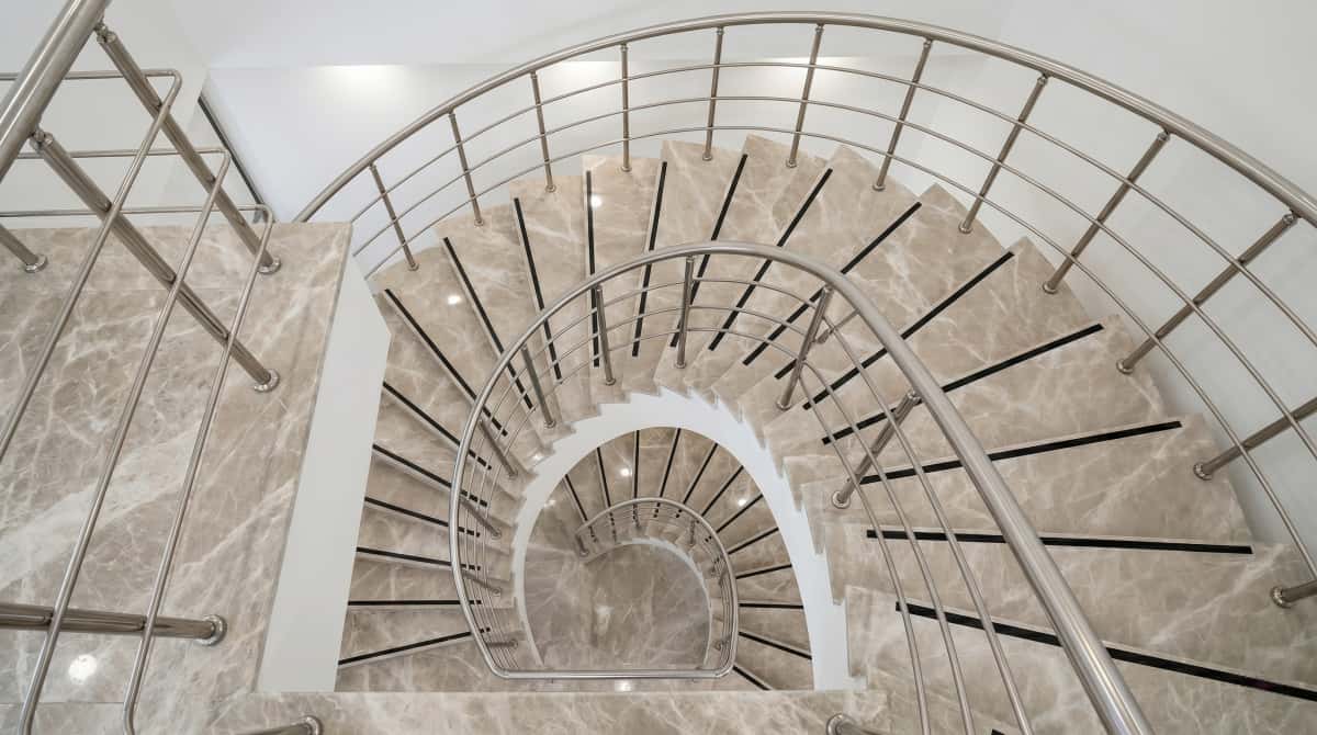 Detailed view of Turkish beige-grey marble stair treads, risers, and side cladding