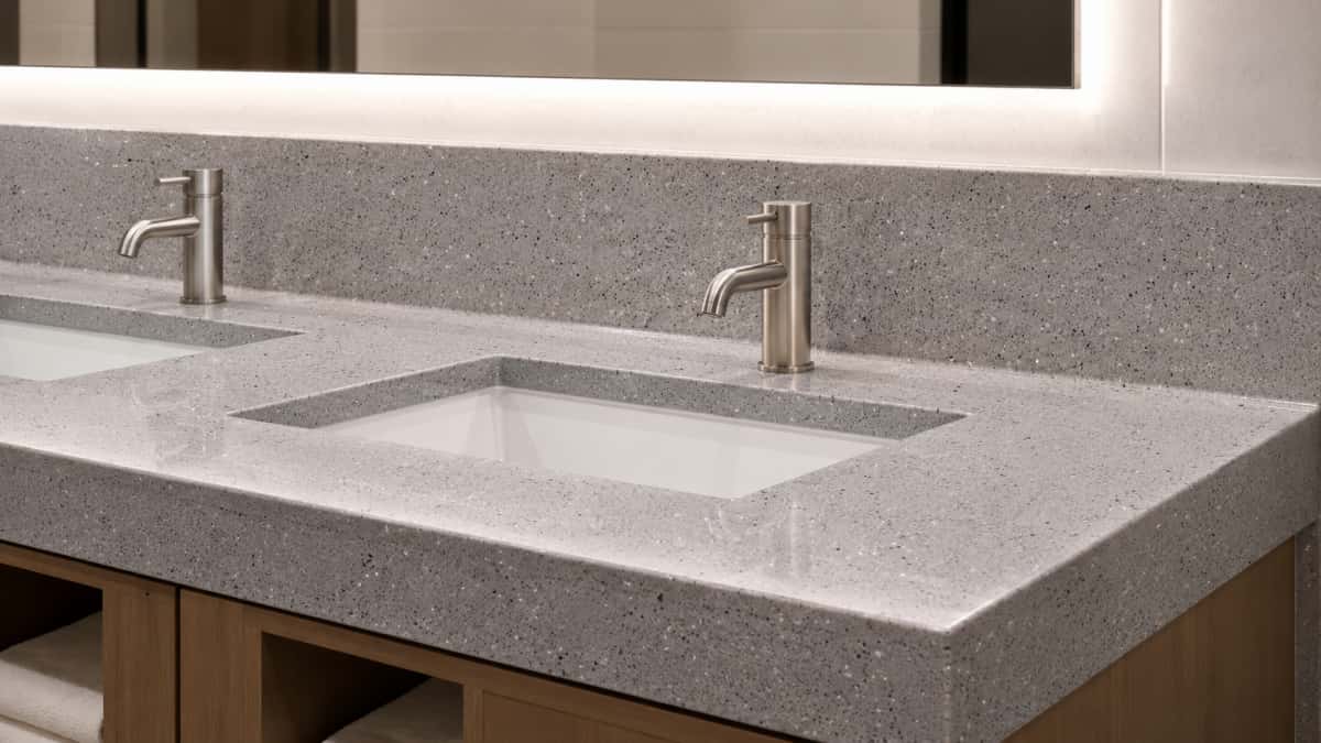 Grey artificial stone vanity top with fine mineral particles