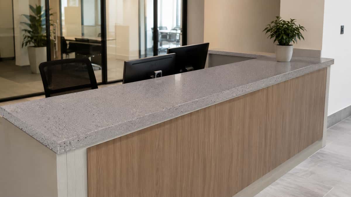 Low maintenance grey artificial marble for interior reception desk surfaces