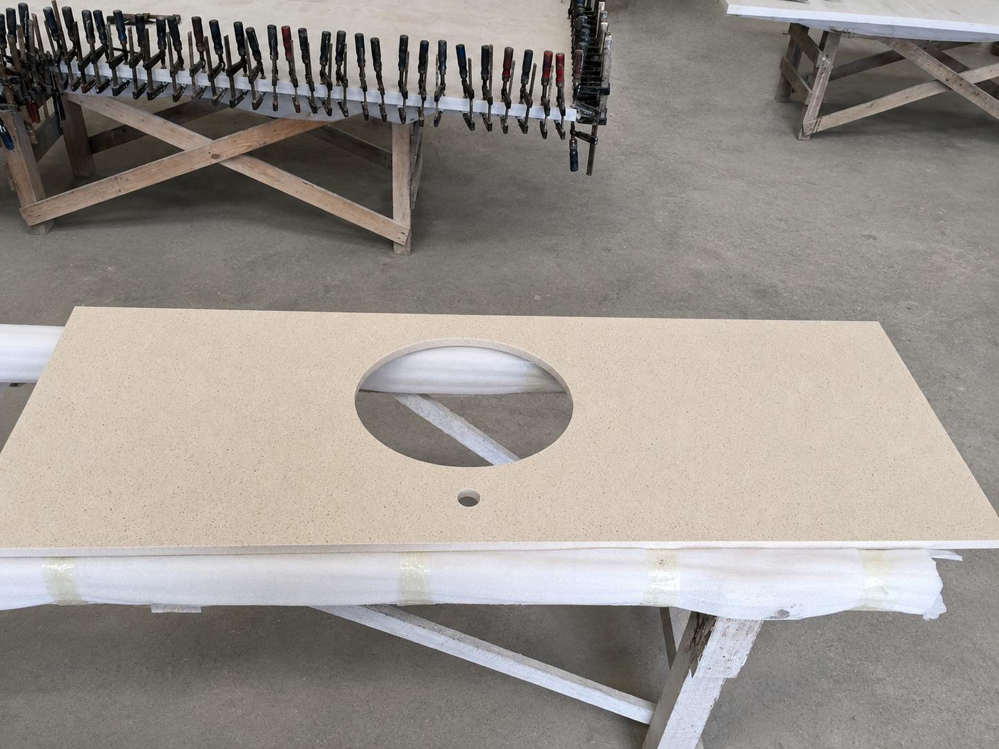 Custom quartz vanity countertop fabricated for a U.S. multifamily project in Aoli Stone factory Custom quartz vanity countertop fabricated for a U.S. multifamily project in Aoli Stone factory
