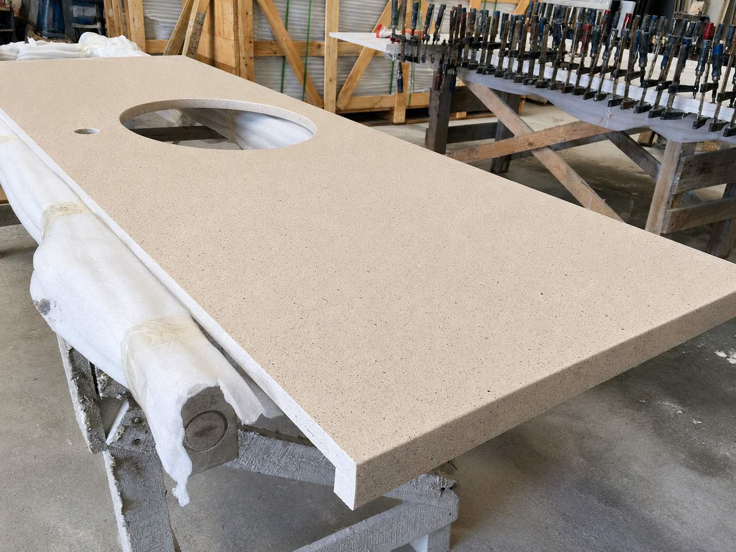 Warm beige quartz countertop with fine speckled texture and polished finish for multifamily bathroom vanity use Warm beige quartz countertop with fine speckled texture and polished finish for multifamily bathroom vanity use