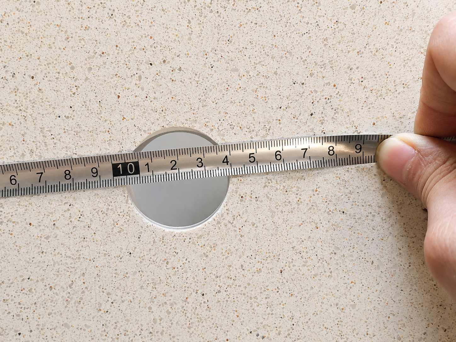 Warm beige quartz countertop with fine speckled texture and polished finish for multifamily bathroom vanity use Warm beige quartz countertop with fine speckled texture and polished finish for multifamily bathroom vanity use