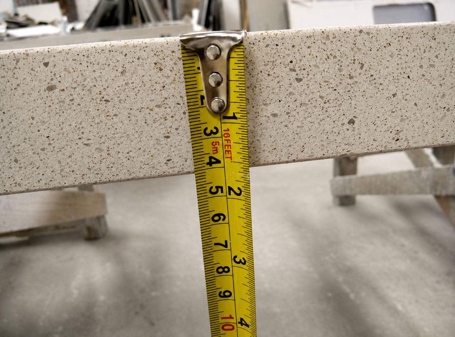 Warm beige quartz countertop with fine speckled texture and polished edge for multifamily countertop Warm beige quartz countertop with fine speckled texture and polished edge for multifamily countertop