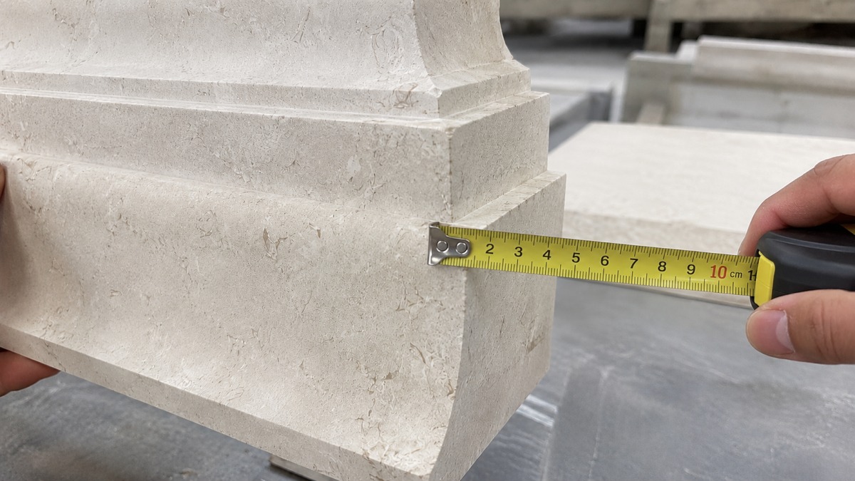 Moonlight Beige Limestone curved molding pieces arranged in the factory for dry lay inspection
