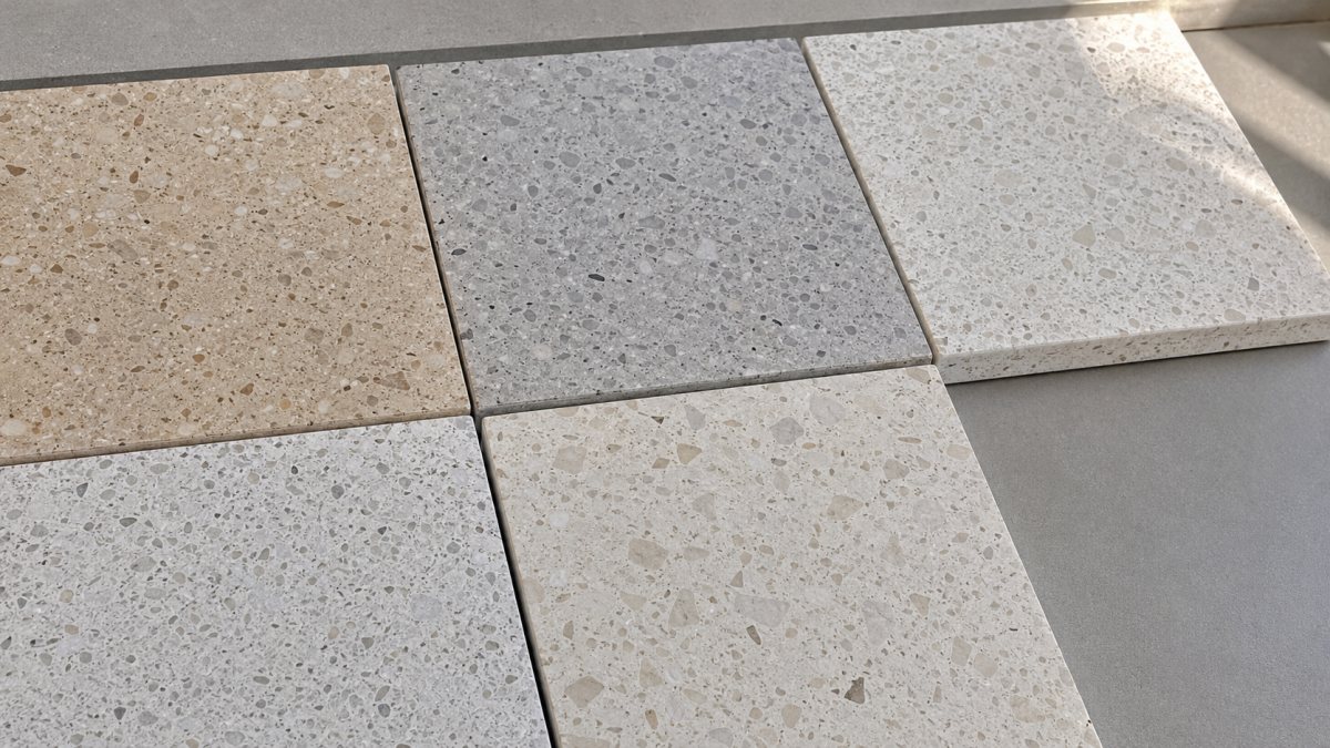 terrazzo-matrix-color-comparison Close-up comparison of terrazzo samples with different matrix color tones