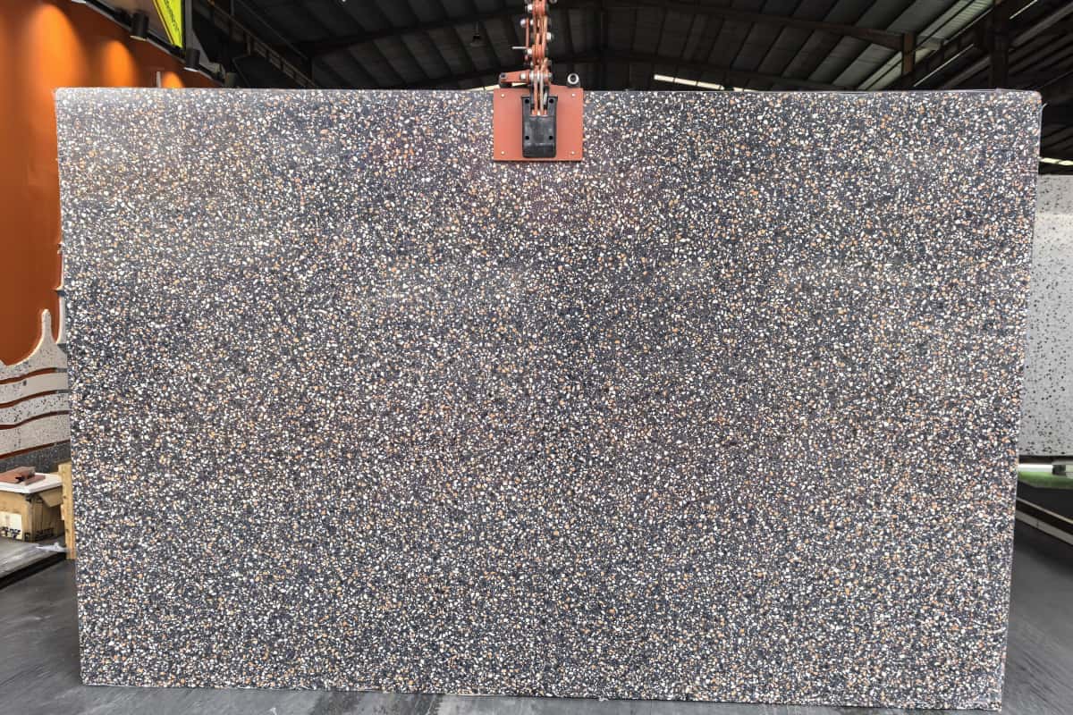 •Full Amber Night black terrazzo slab showing dense white and amber chip distribution •Status: Real evidence; reshoot recommended