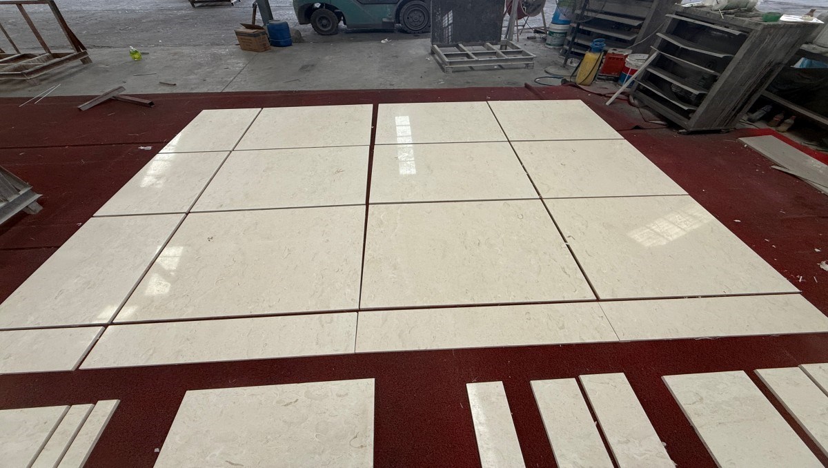Cut-to-size Moon Beige limestone panels arranged for tone and sequence inspection